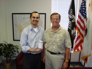 Craig delivers a can to a staff person in Rep. Linda Sanchez's office.